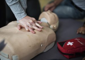 cpr practiced on dummy in cpr training